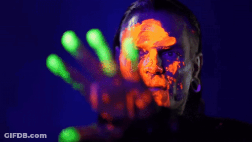 Person With Glow In The Dark Paint On Face And Hands GIF