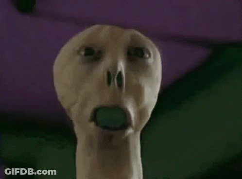 Person With Green Object In Open Mouth GIF