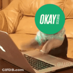 Person With Green OK Sticker On Face At Laptop GIF