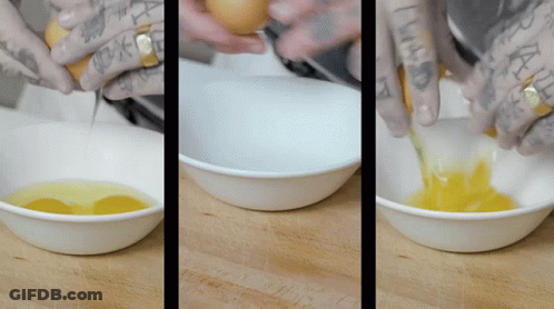 Person With Hand Tattoo Mixing Yellow Liquid In Bowl GIF