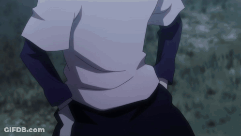 Person With Hands In Pockets Standing In Dark GIF