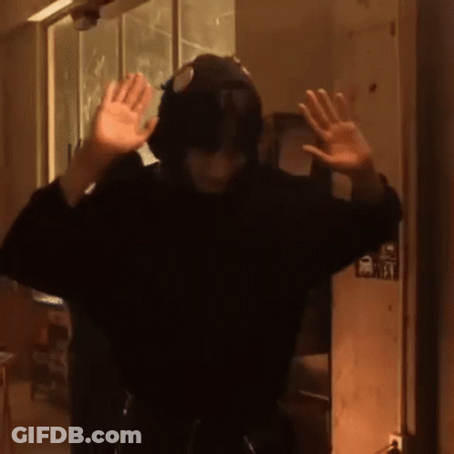 Person With Hat And Headphones In Dark Room GIF