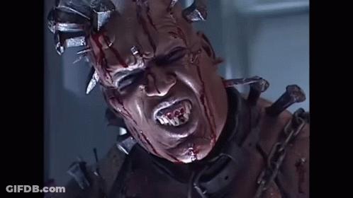 Person With Head Spikes And Chain GIF