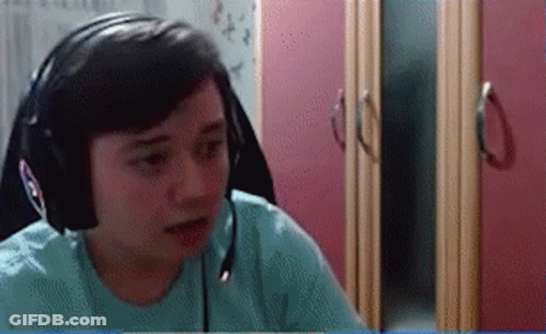 Person With Headphones And Microphone In Front Of Pink Cabinet GIF
