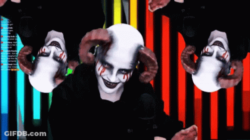 Person With Horns In Front Of Screen Saying A GIF