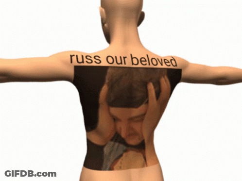 Person With Man On Back Saying Russ Our Beloved GIF