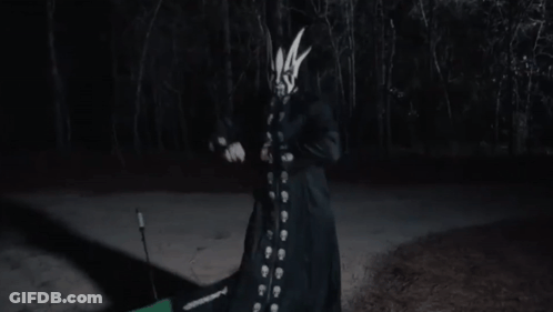 Person With Mask Holding Stick GIF