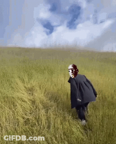 Person With Mask Walking Through Tall Grass GIF