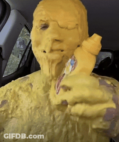 Person With Mustard Bottle On Face GIF