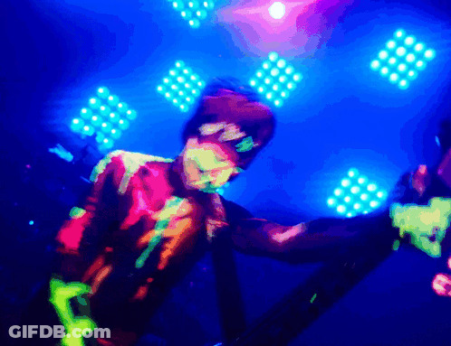 Person With Neon Paint Dancing In Blue Light GIF
