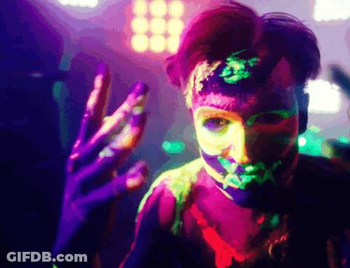 Person With Neon Paint On Face And Body GIF