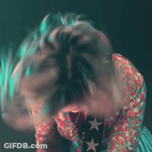 Person With Open Mouth And Star Necklace GIF