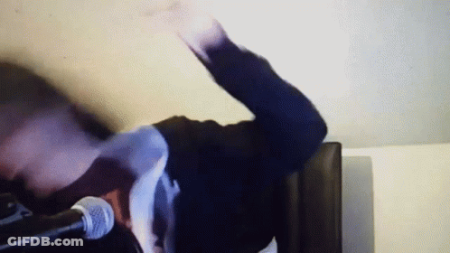Person With Outstretched Arm At Microphone GIF