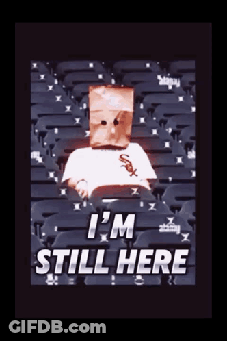 Person With Paper Bag Saying I'm Still Here GIF