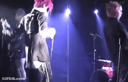Person With Pink Hair Singing Into Microphone GIF