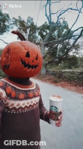 Person With Pumpkin Head Holding Starbucks Coffee GIF