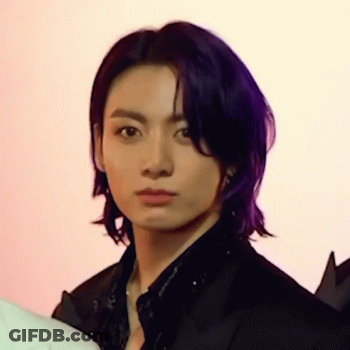 Person With Purple Hair Looking At Camera GIF