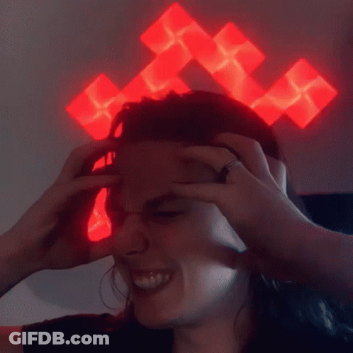 Person With Red Cross On Head Smiling GIF