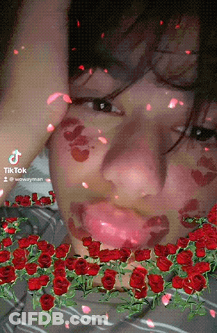 Person With Red Roses On Face TikTok Watermark GIF