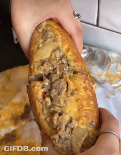 Person With Ring Holding Sandwich GIF