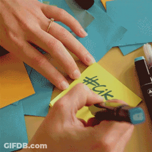 Person With Ring Writing #Cik On Yellow Sticky Note GIF