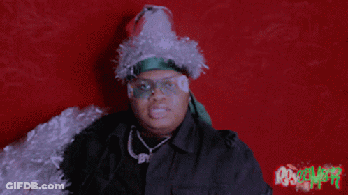 Person With Santa Hat And Tinsel Thumbs Up GIF