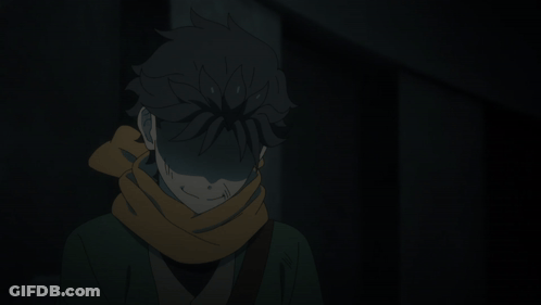 Person With Scarf Standing In Dark Room GIF