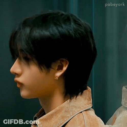 Person With Short Hair In Denim Jacket GIF