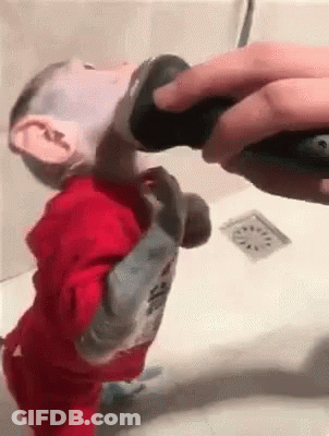 Person With Tattoo On Foot Next To Another Foot GIF