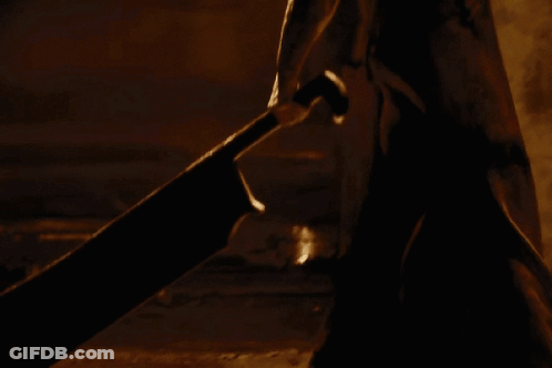 Person With Triangle On Back In Dark GIF