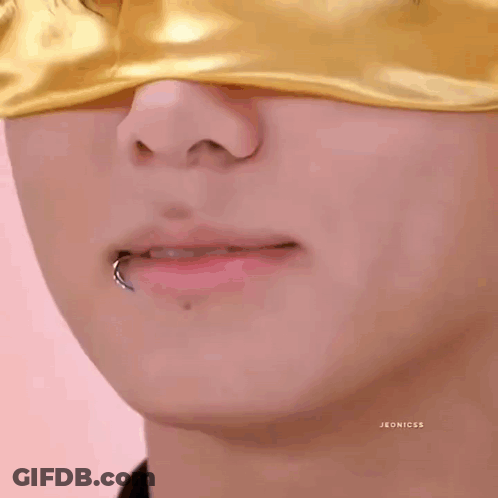 Person With Yellow Eye Mask And Lip Piercing GIF