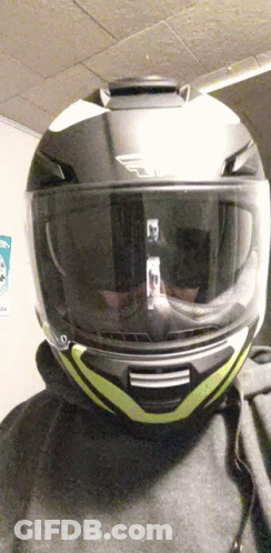 Person With Yellow-Striped Motorcycle Helmet GIF