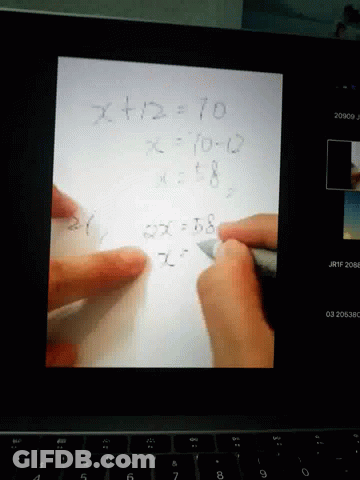 Person Writing Math Problem GIF