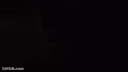 Person Writing On Paper In Dark GIF