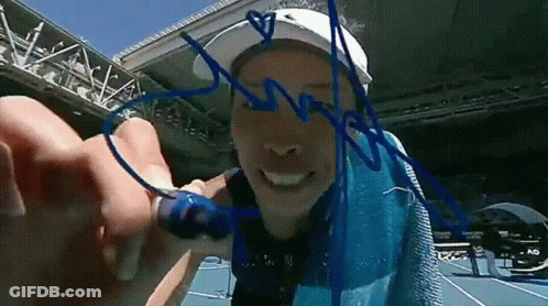 Person Writing On Paper With Marker Saying N GIF