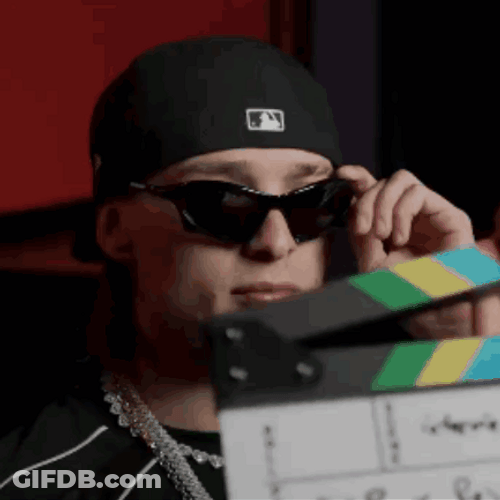 Peso Pluma Holding Sunglasses GIF