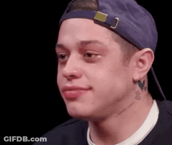 Pete Davidson Holding Back His Laugh GIF