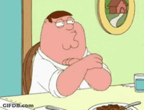 Peter Griffin From Family Guy Is Sitting At A Table GIF