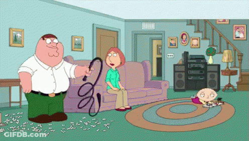 Peter Griffin Is Holding A Whip In His Hand While Lois Griffin Sits On A Couch GIF