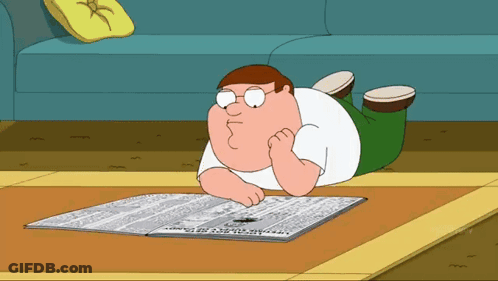 Peter Griffin Is Reading A Newspaper On The Floor GIF