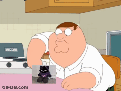 Peter Griffin Is Sitting At A Table With A Stuffed Animal GIF