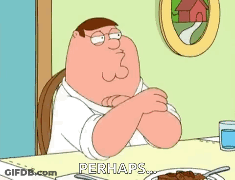 Peter Griffin Is Sitting At A Table With His Arms Crossed . GIF