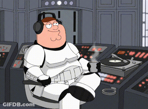 Peter Griffin Is Wearing Headphones And Holding A Cup Of Coffee While Sitting In Front Of A Record Player GIF