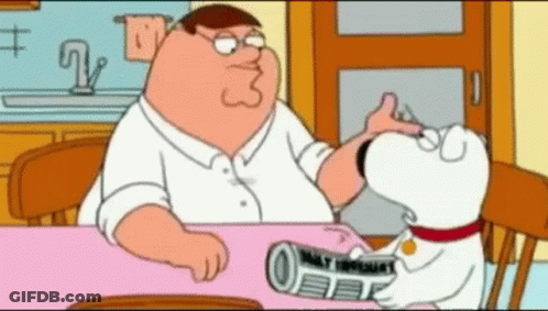 Peter Griffin Sitting At Table With Dog Holding Newspaper GIF