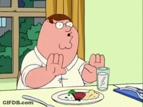 Peter Griffin Sitting At Table With Plate Of Food GIF