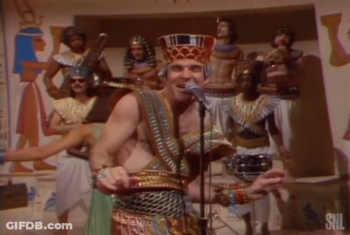 Pharaoh Costume Man Singing Into Microphone GIF