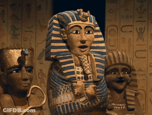Pharaoh Statue With Blue And Gold Striped Robe GIF
