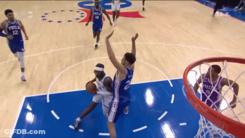 Philadelphia Basketball Player Shooting Over Defender GIF