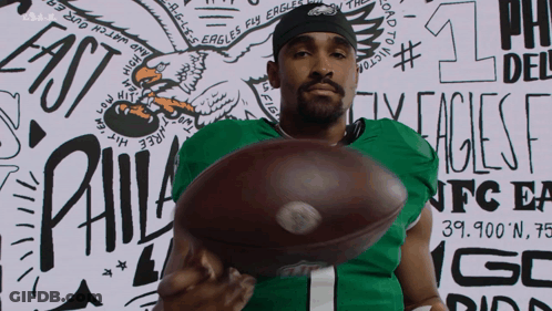 Philadelphia Eagles Player Holding Football GIF