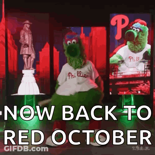 Phillies Mascot Dancing In Front Of Statue Saying Now Back To Red October GIF